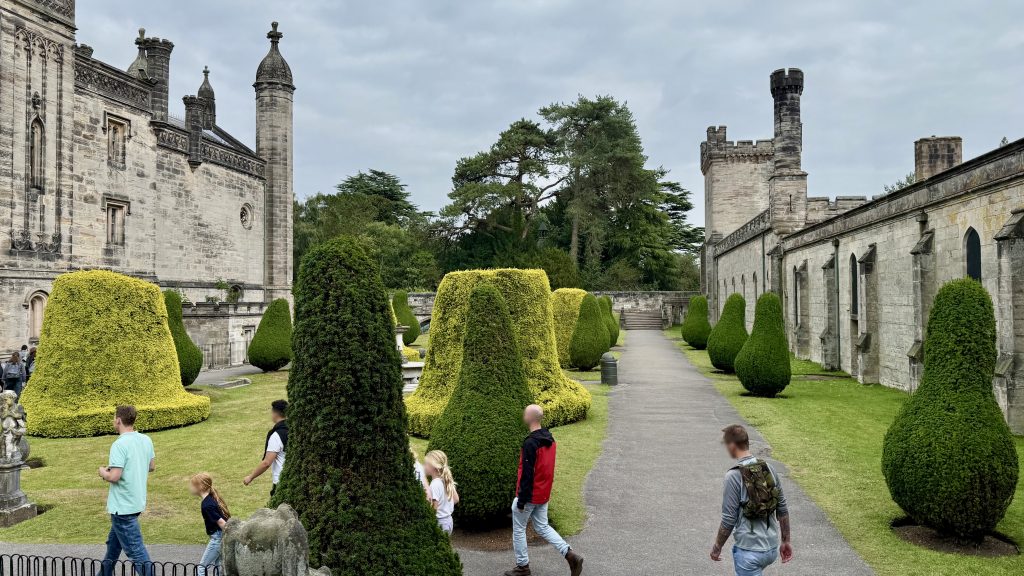 A garden with various shaped topiary. 