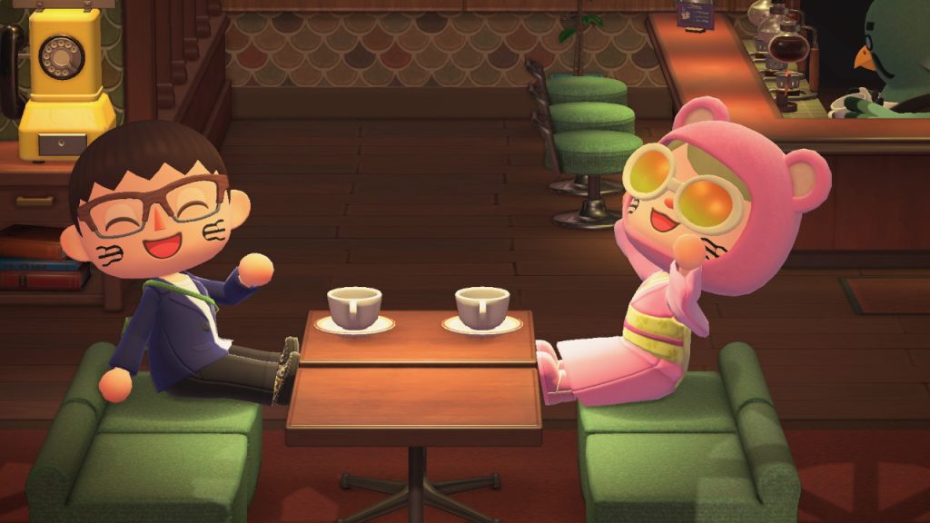 Kai and Payton's Animal Crossing characters at a table in a café with coffee